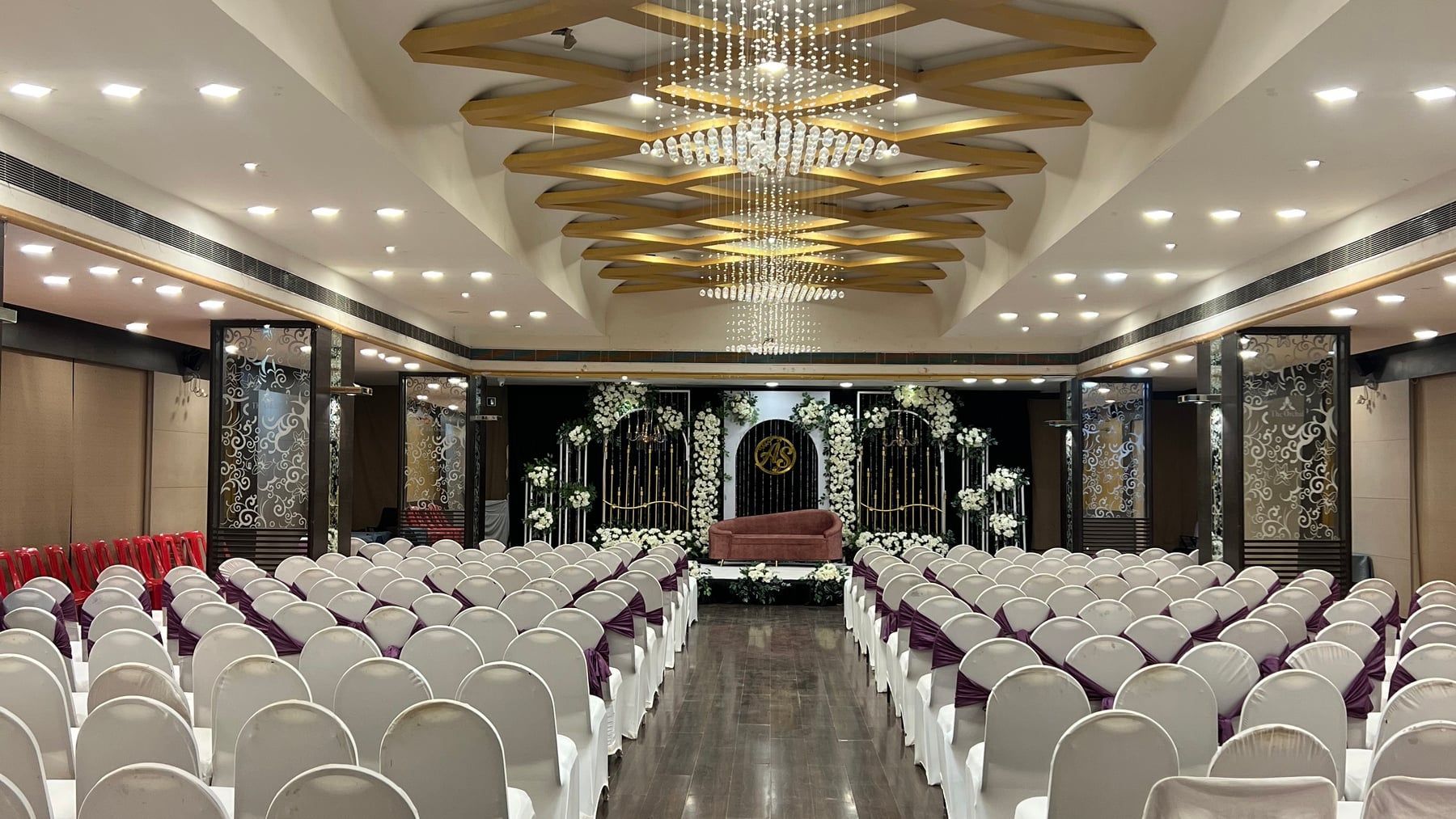 The Orchid Hall set for a reception under a gold chandelier ceiling