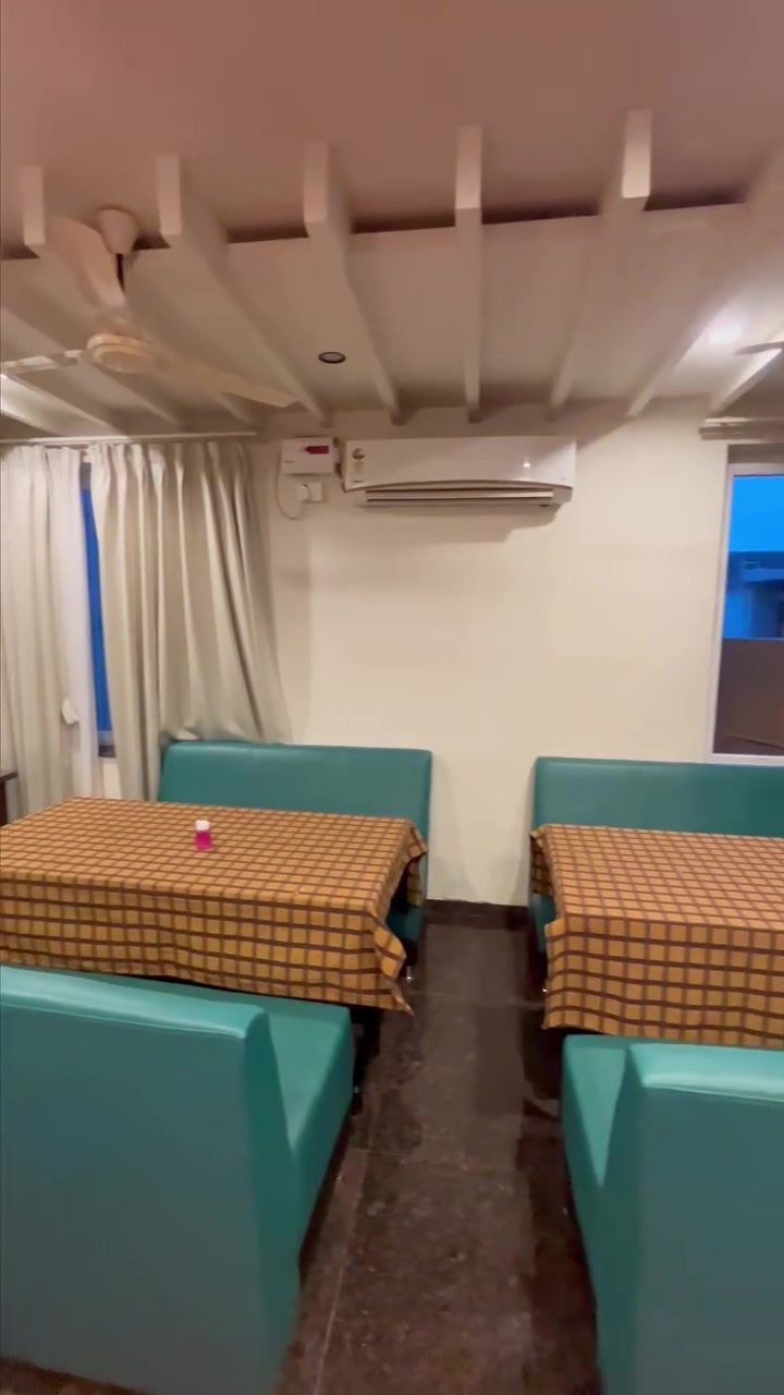 Teal booths in the restaurant