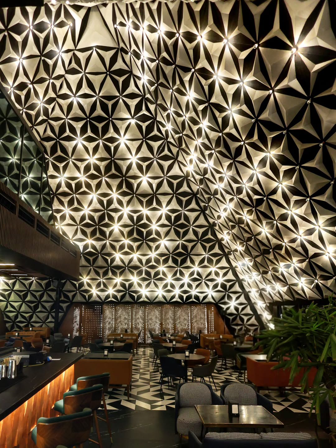 The star-patterned ceiling glowing over the dining room