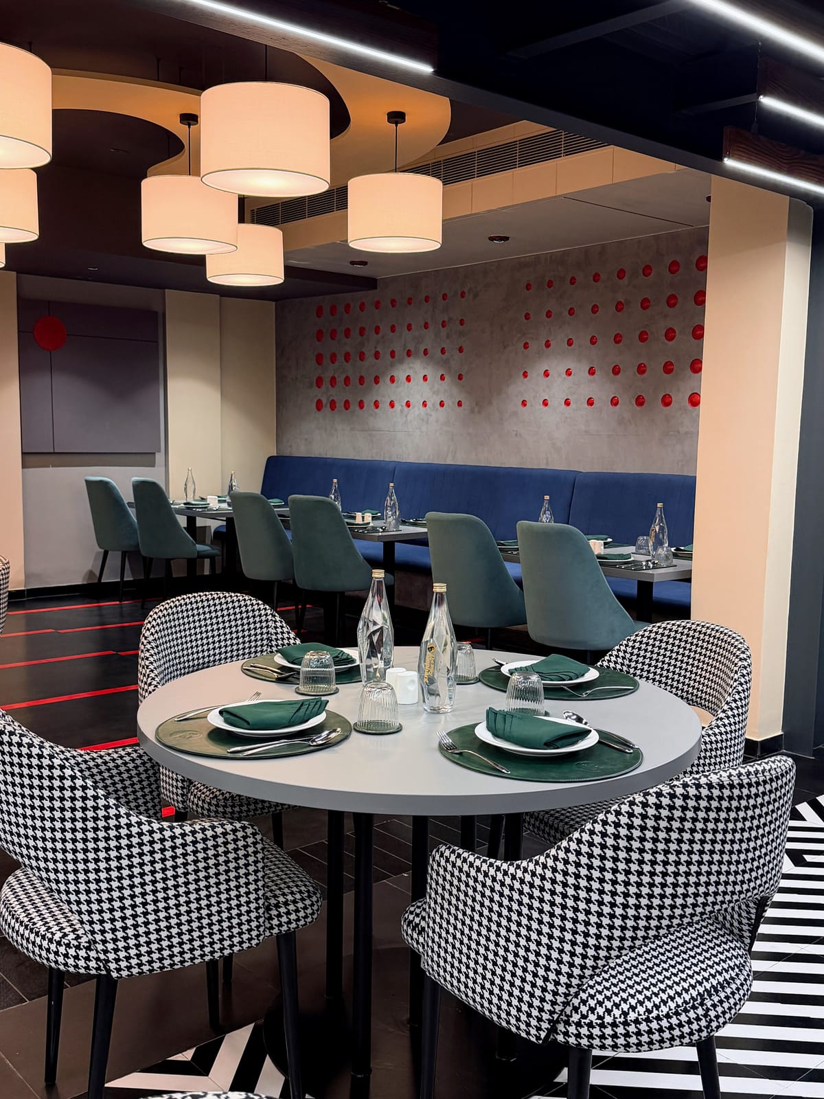 The dining room, laid and lit