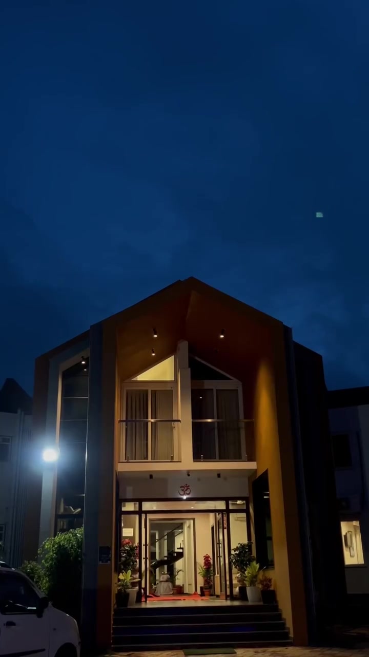 The resort building lit up at dusk