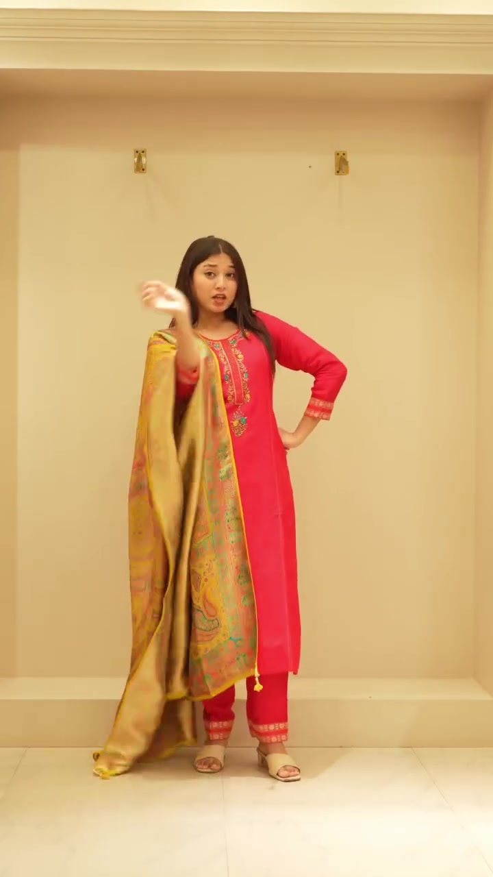 Red kurta set worn with a gold woven dupatta