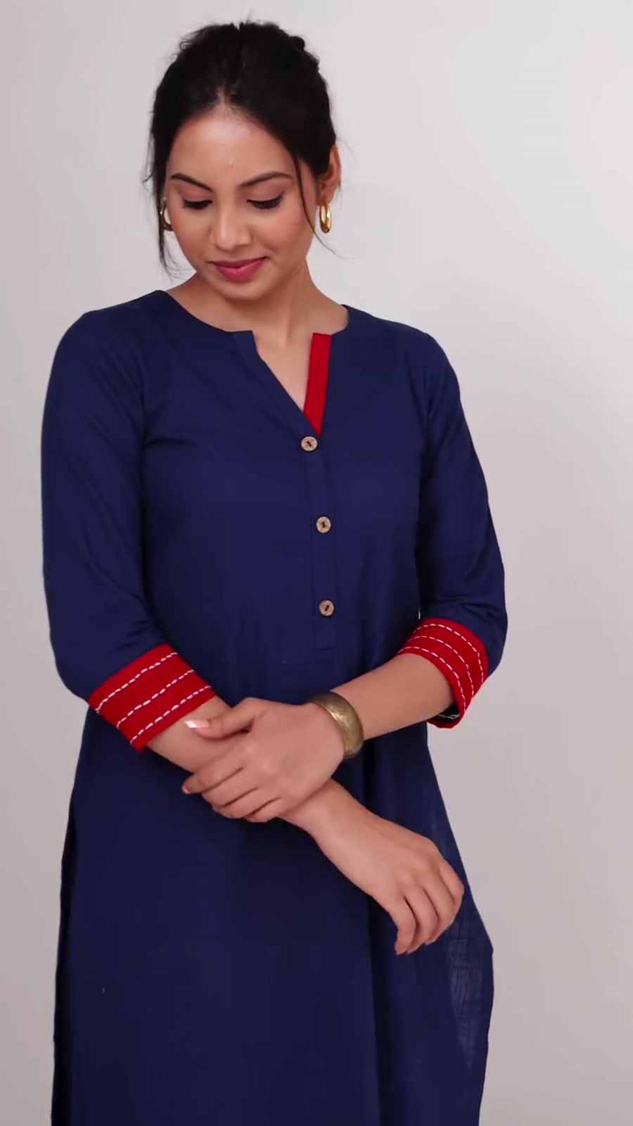 Indigo kurta set against a plain studio wall