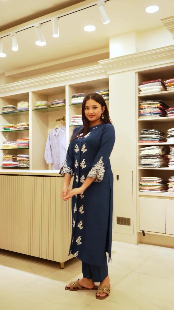 Navy kurta set with white floral embroidery in the Aroshh boutique