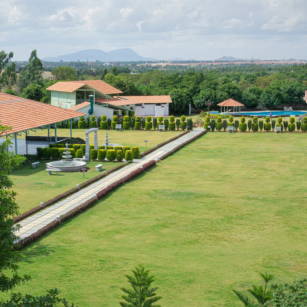 The Camaraderie lawns with paved paths and the pavilion