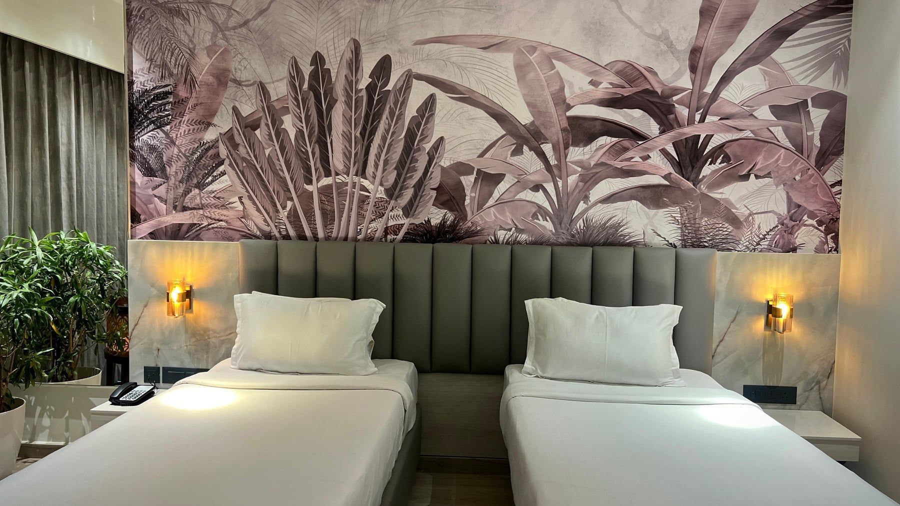Twin room with a palm mural