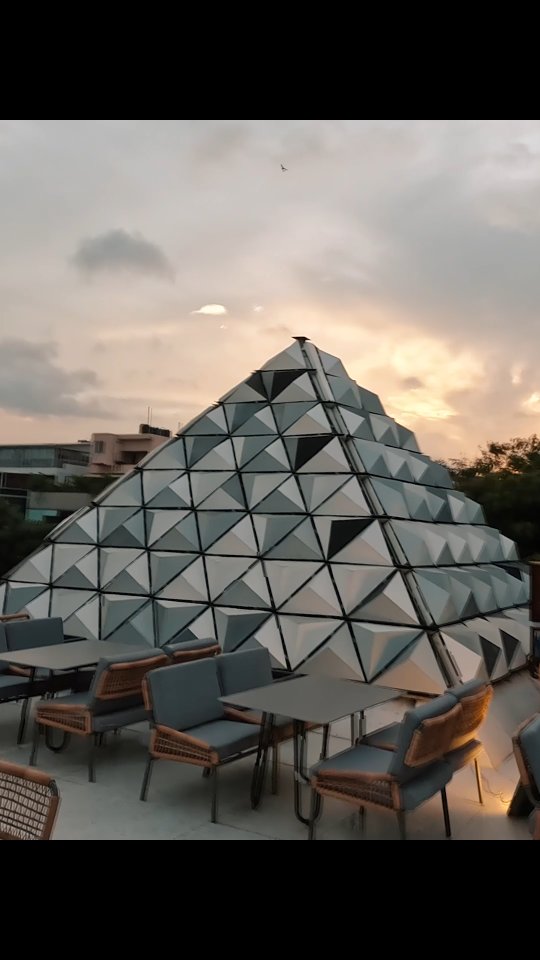The pyramid's faceted facade at dusk