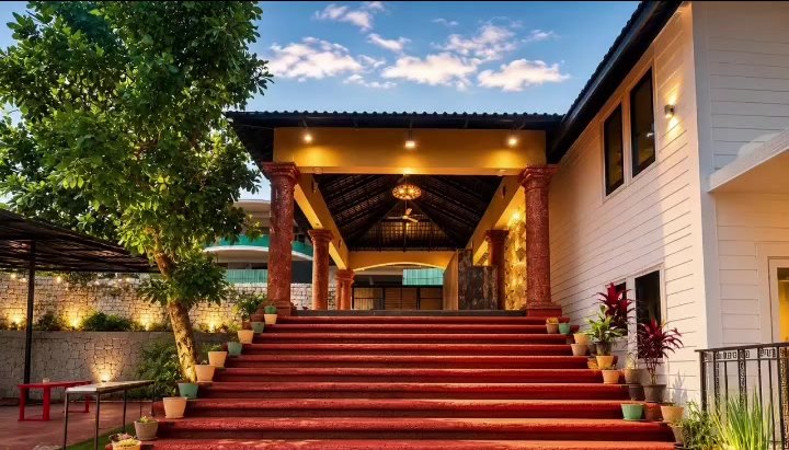 The red-carpeted steps up to the cottages, lined with lights