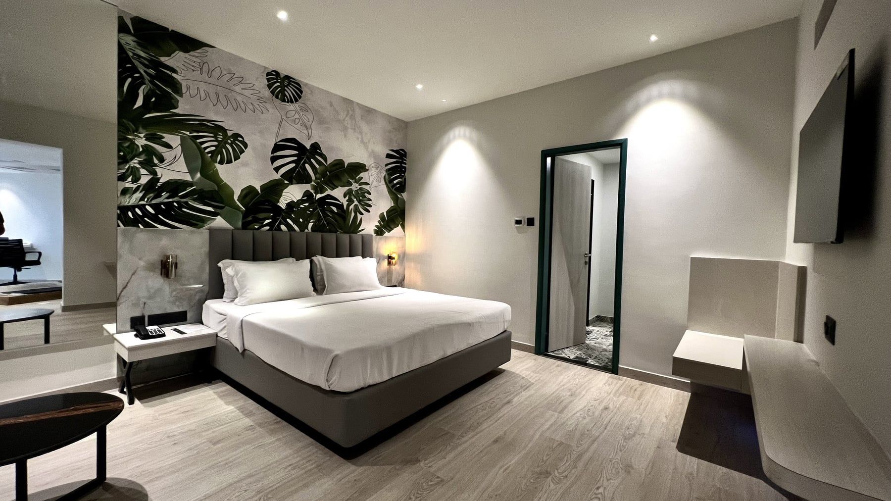 Suite bedroom with a feature wall