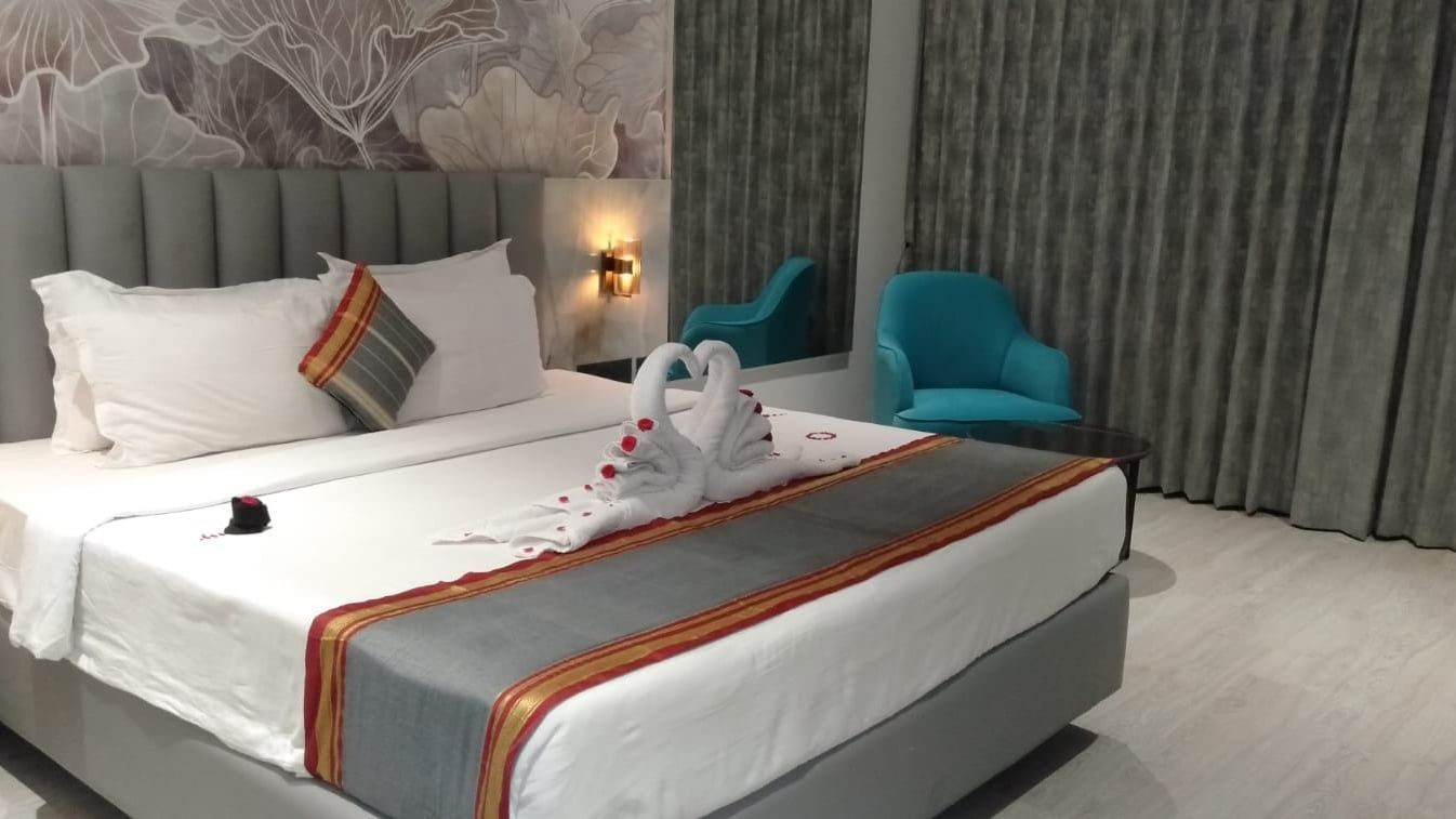 Towel swans on a freshly made bed